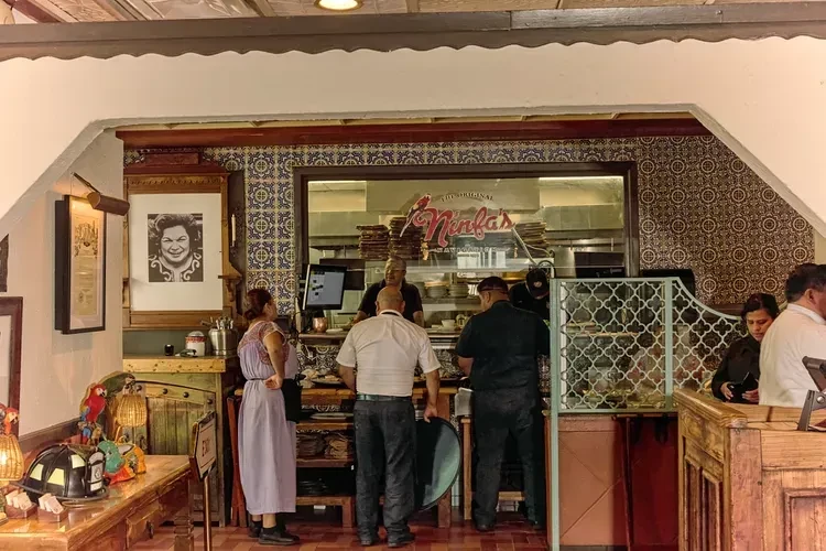 Busy restaurant service counter at The Original Ninfa's.