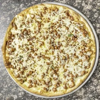 Overhead shot of a pizza covered with melted cheese and cooked meat.