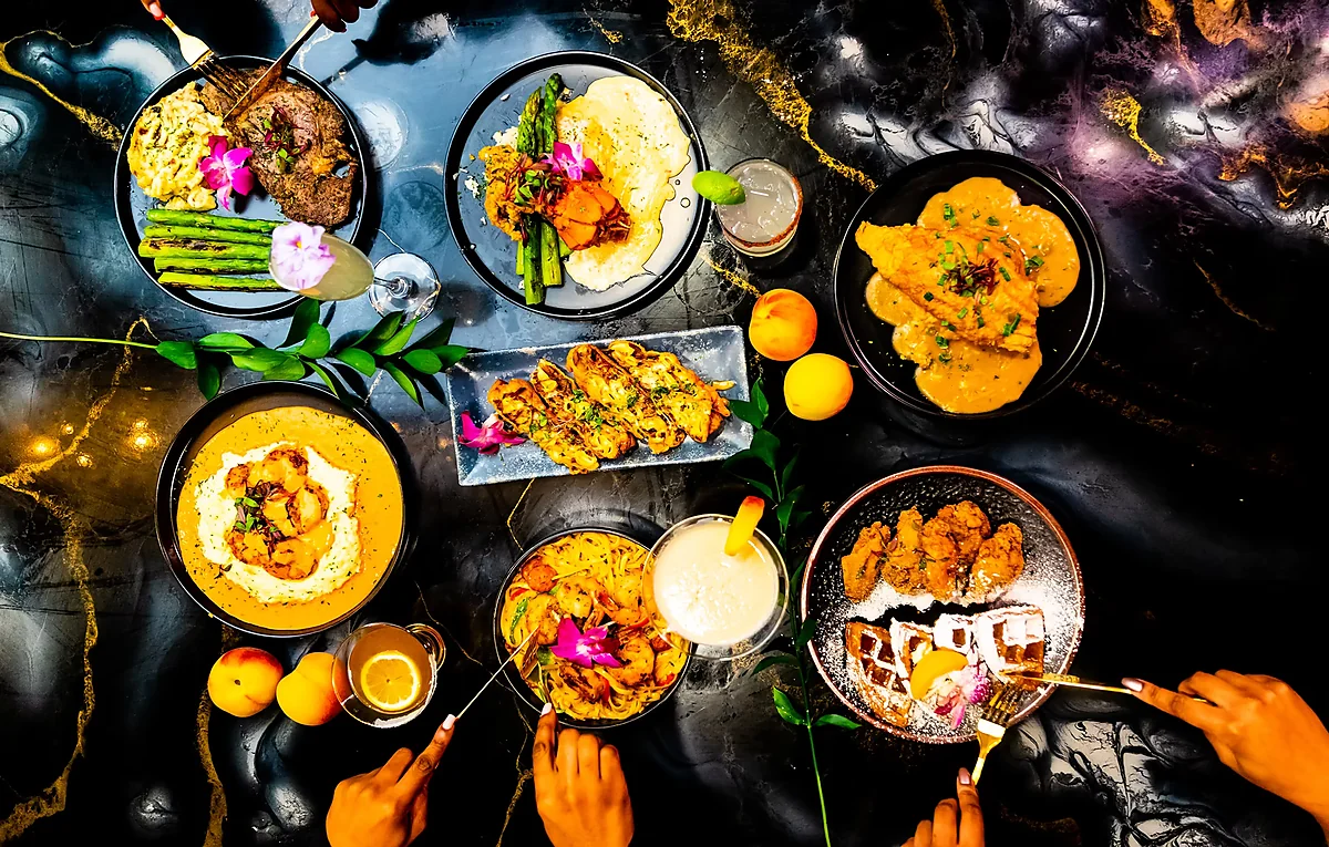 Overhead spread of southern entrees, cocktails and desserts on table