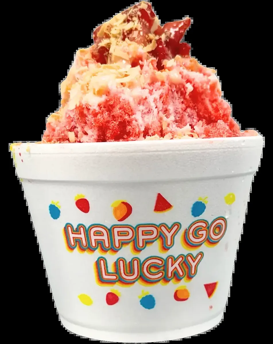 Strawberry shave ice topped with toasted coconut flakes in foam cup