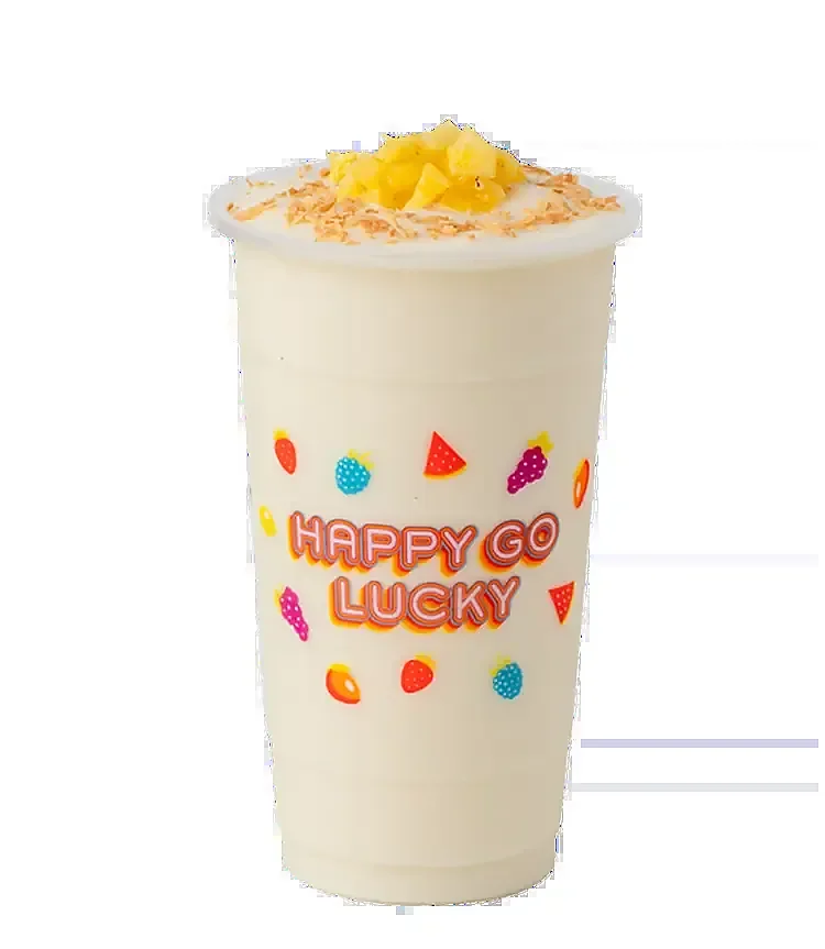 Frozen pina colada topped with diced pineapple and toasted coconut