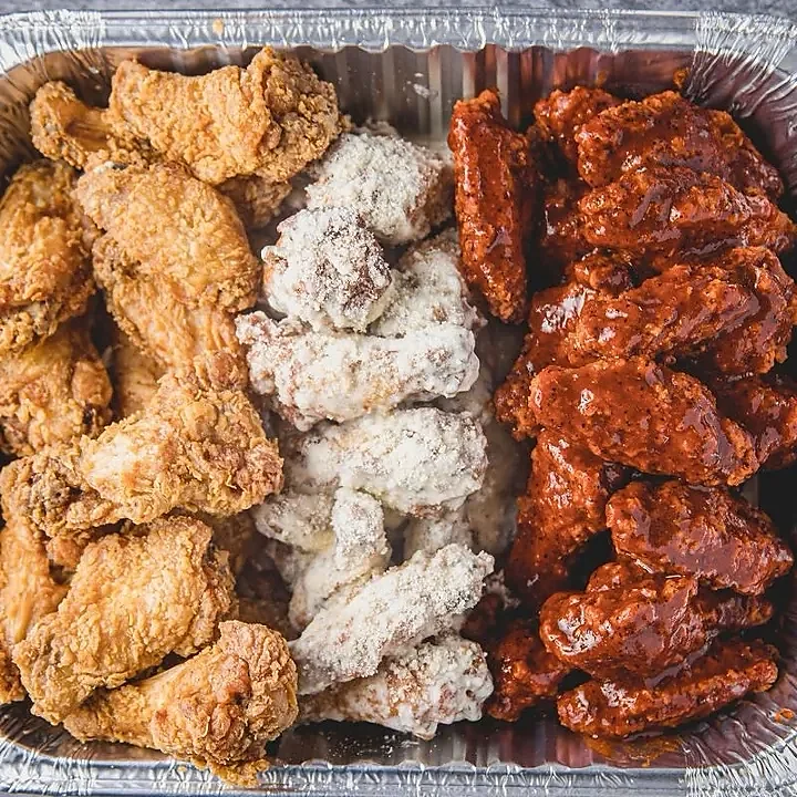 Foil tray of wings in three flavors including lemon pepper