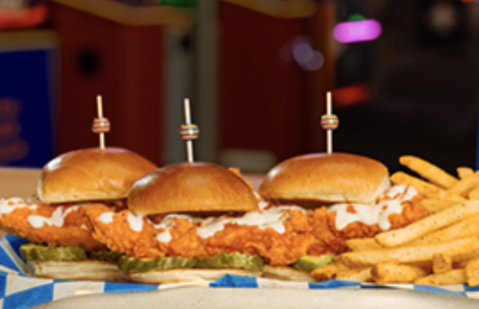 Crispy fried chicken sandwiches topped with pickles and served on soft brioche buns.