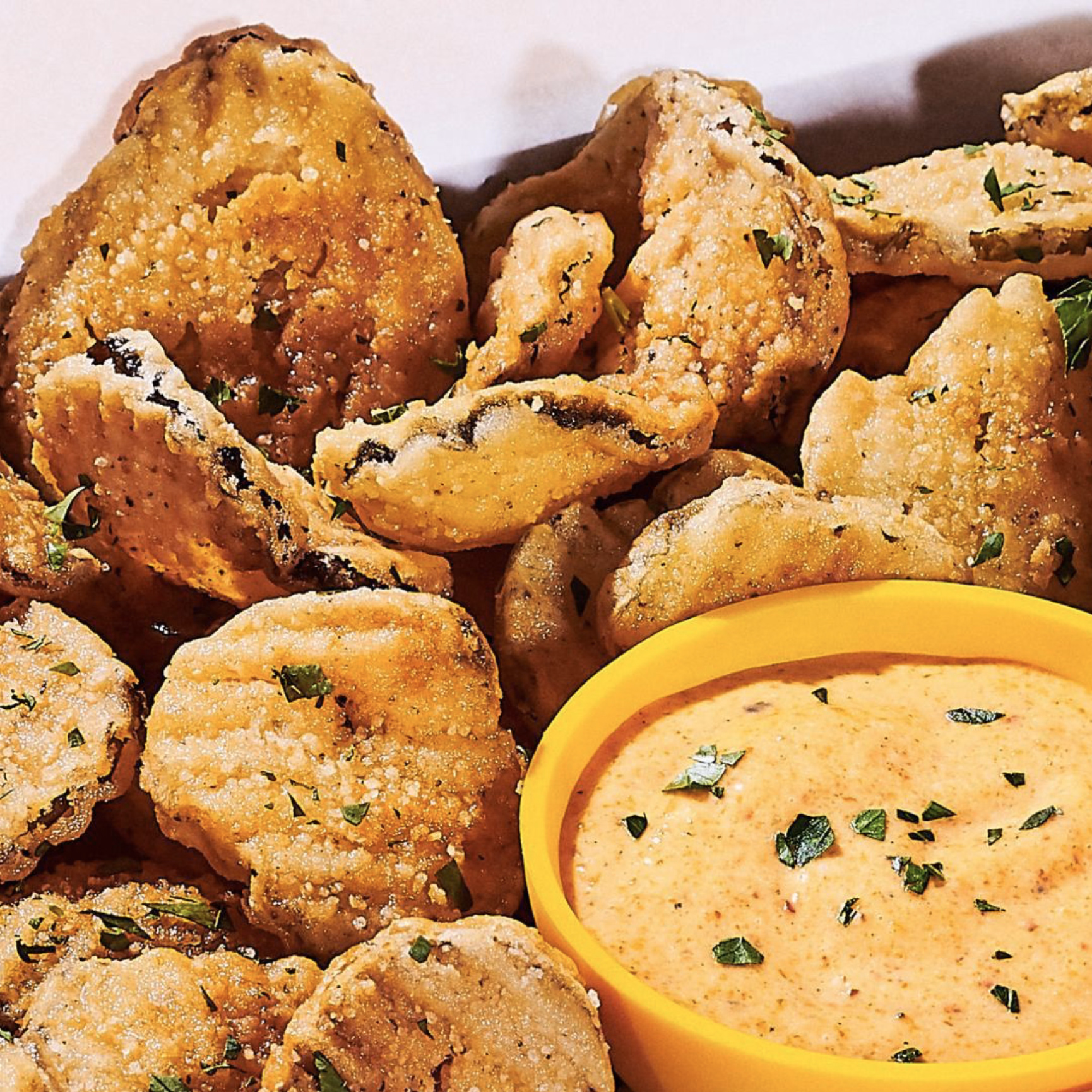 Golden fried pickles with zesty ranch dip.