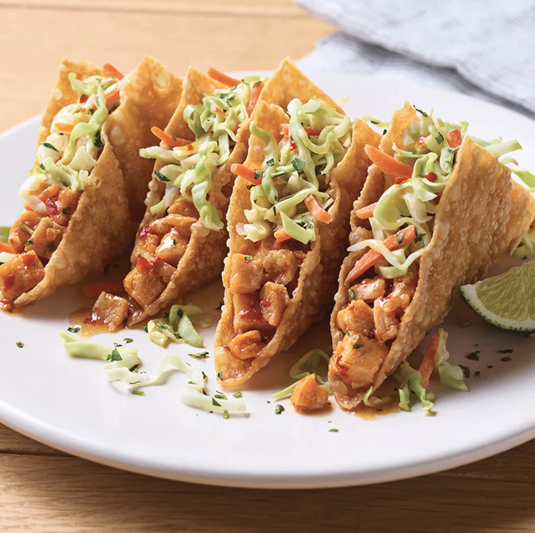 Crunchy wonton tacos filled with chicken, slaw, and sweet chili sauce.