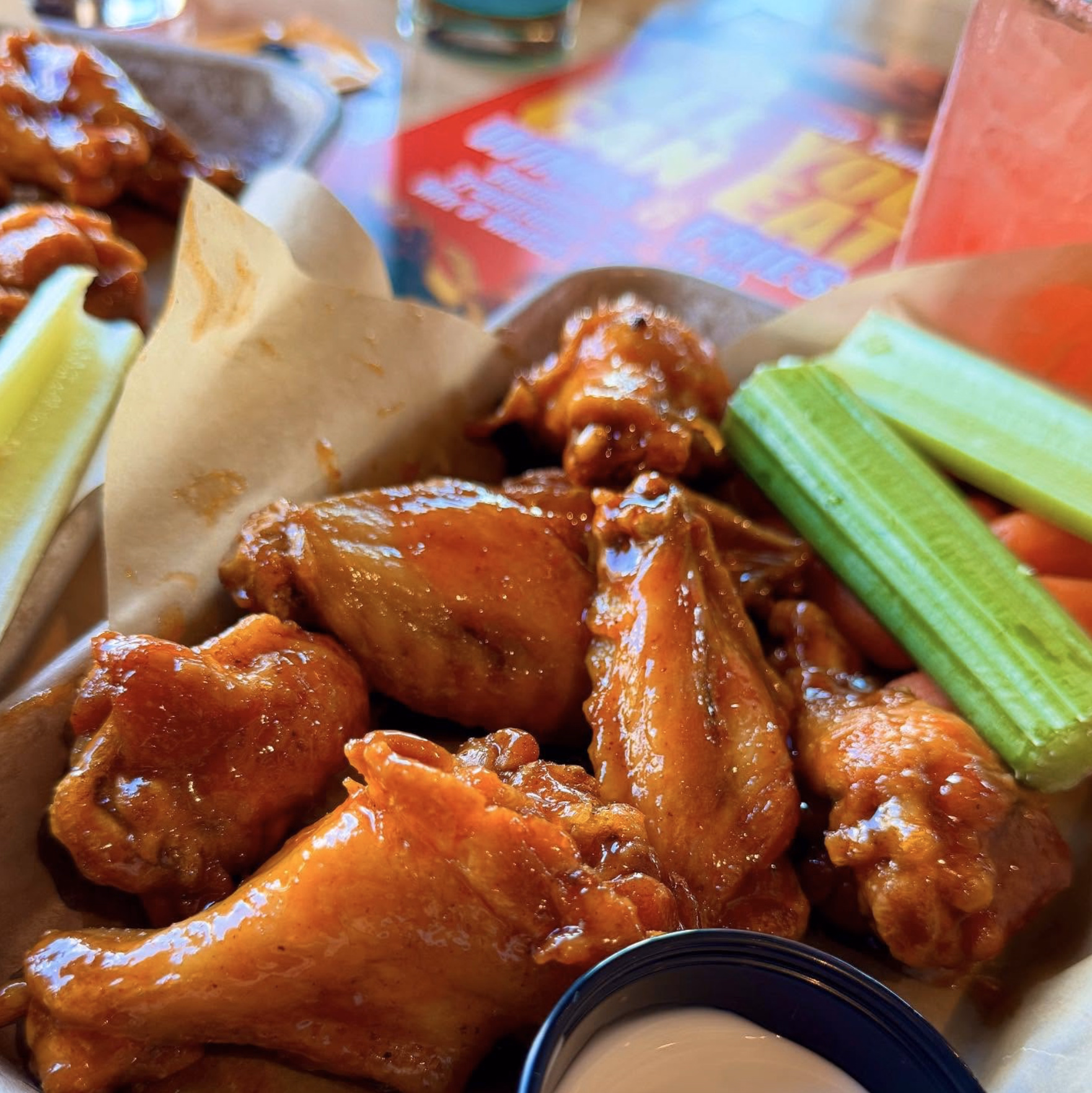 Saucy chicken wings with fresh veggie sticks and ranch dip at Buffalo Wild Wings.