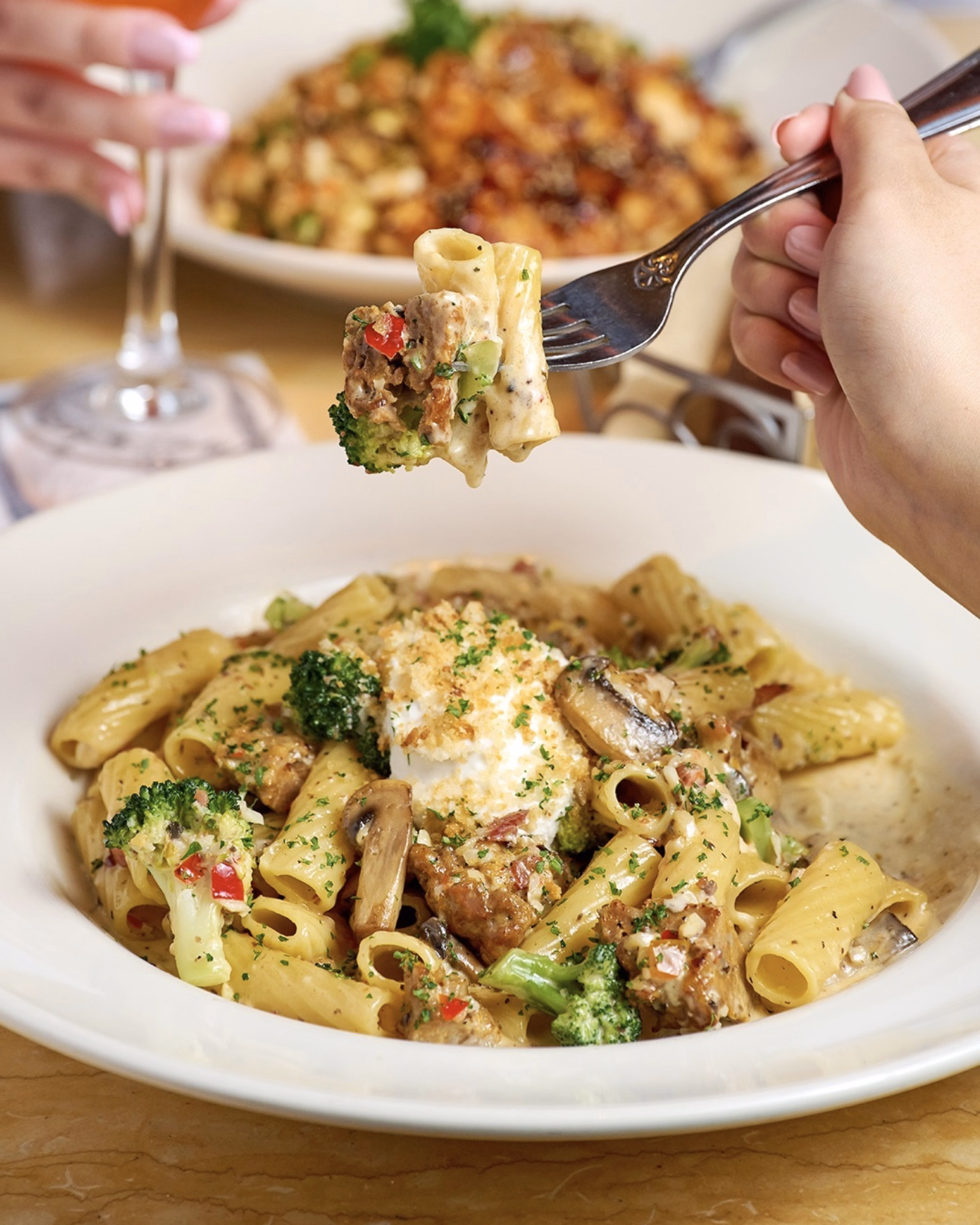 Rigatoni tossed in creamy sauce with fresh vegetables.