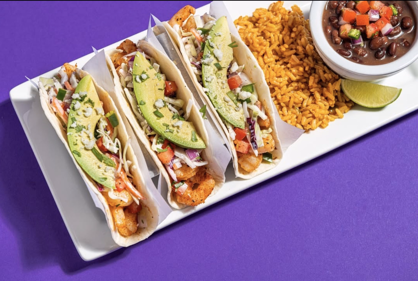 Shrimp tacos with rice & beans.