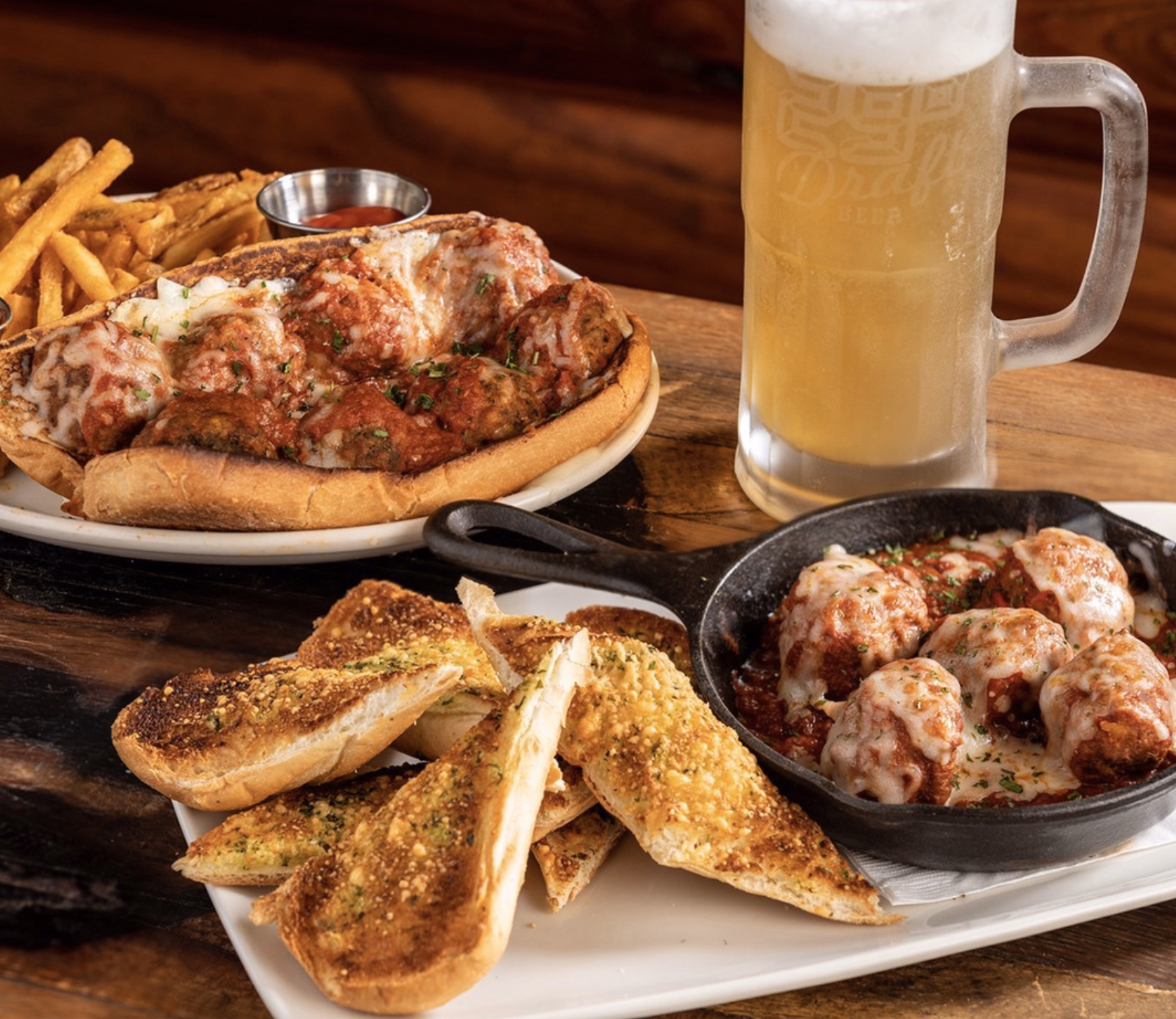 Hearty meatball sub with marinara, melted cheese, and fries.