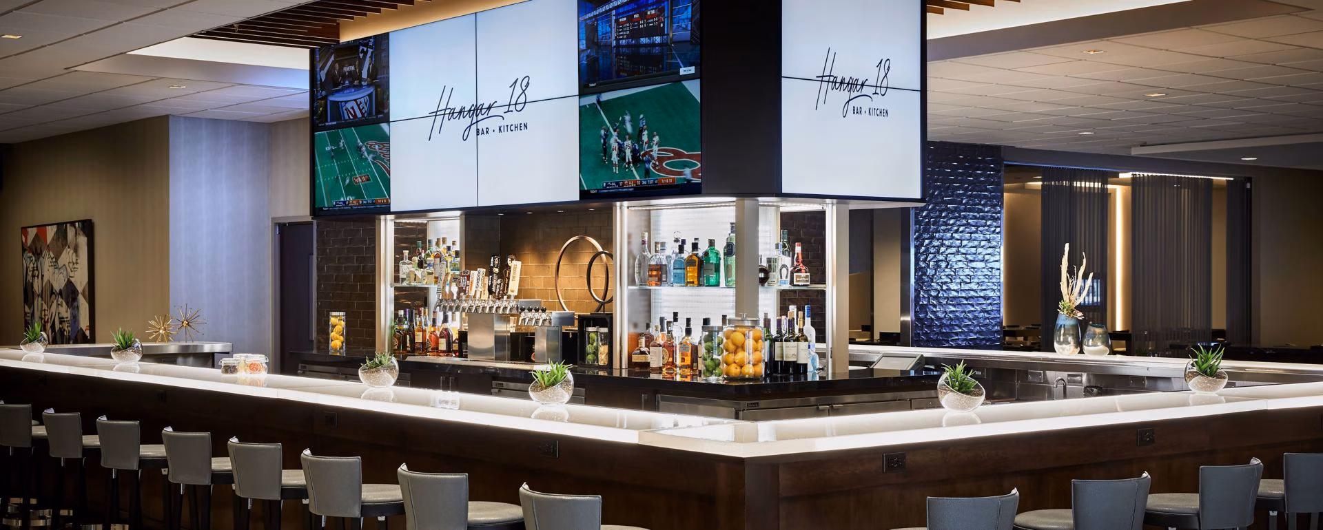 Hangar 18 Bar + Kitchen logo