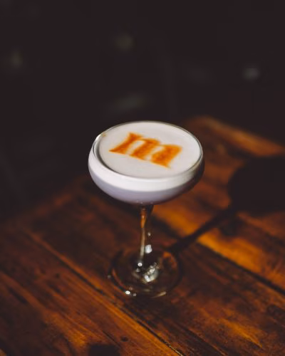 Mauve Nosh & Libations logo