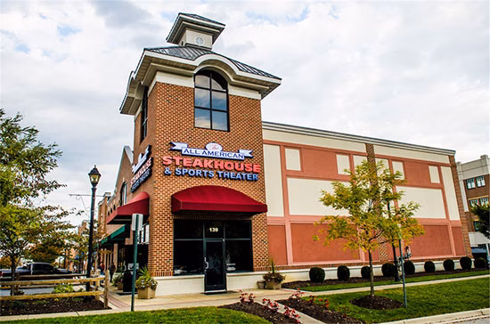 The All American Steakhouse & Sports Theater logo